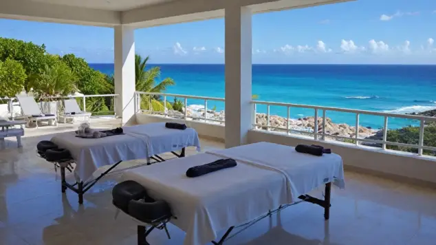 multiple massage tables at villa overlooking caribbean ocean